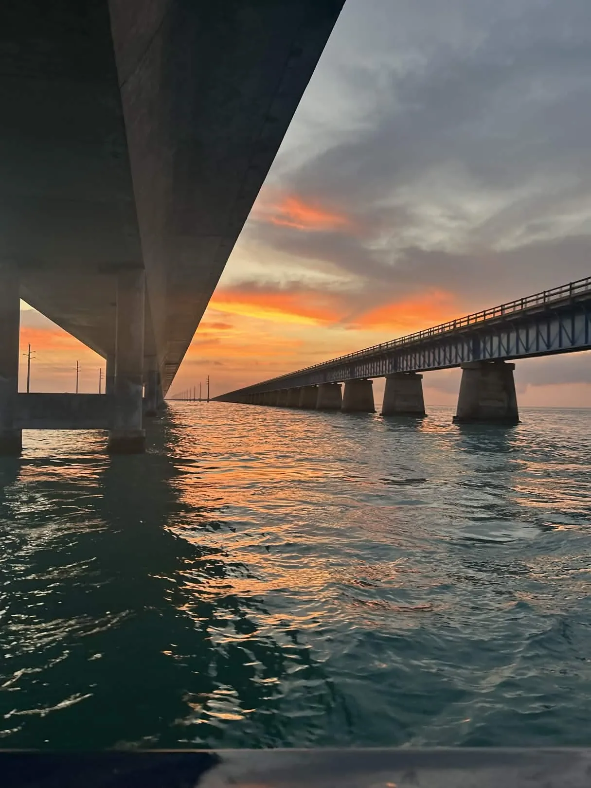 Sunset glowing between Florida Keys bridges near Marathon