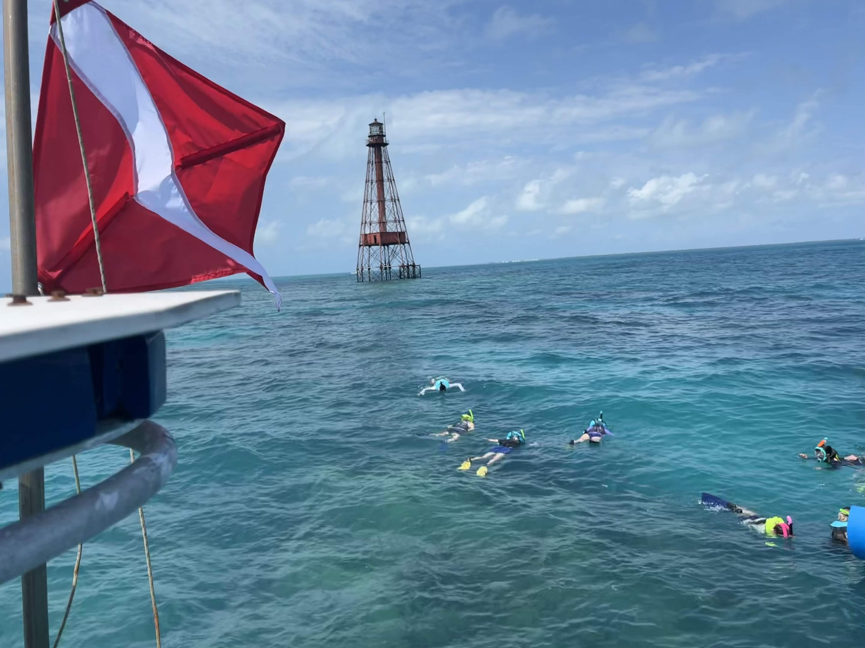 Guests snorkeling near Sombrero Reef lighthouse in Marathon